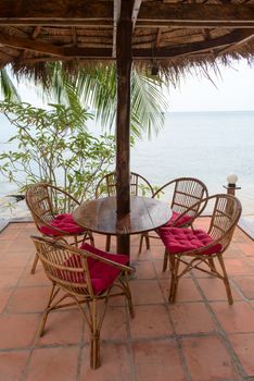 Relaxing lounge chair relax area in beach cafe by the blue sea
