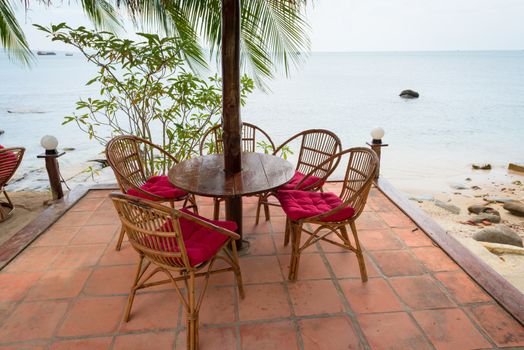 Relaxing lounge chair relax area in beach cafe by the blue sea