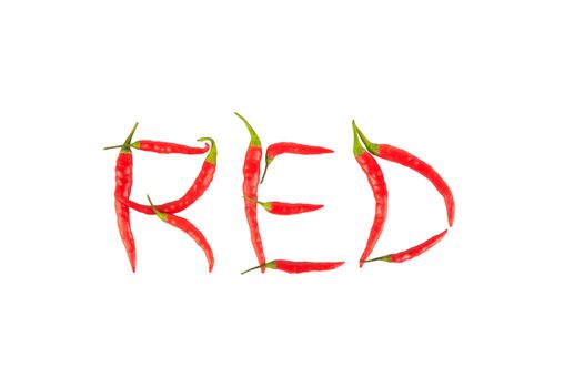 Fresh and dried chili peppers isolated on white background, created is the "RED" word. 