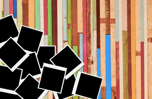 Blank instant photo frames on wooden background. 