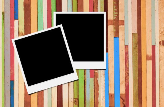 Blank instant photo frames on wooden background. 
