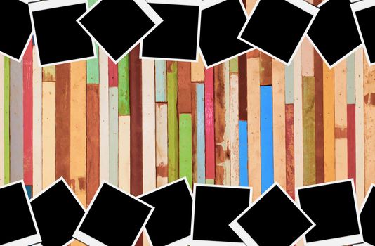 Blank instant photo frames on wooden background. 
