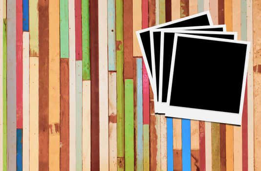 Blank instant photo frames on wooden background. 