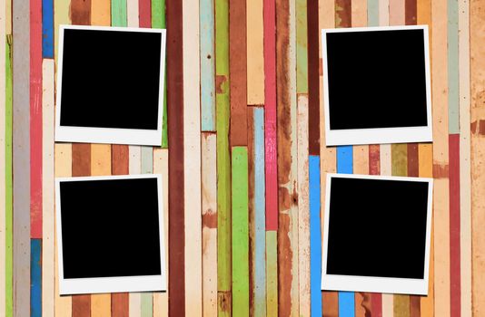 Blank instant photo frames on wooden background. 