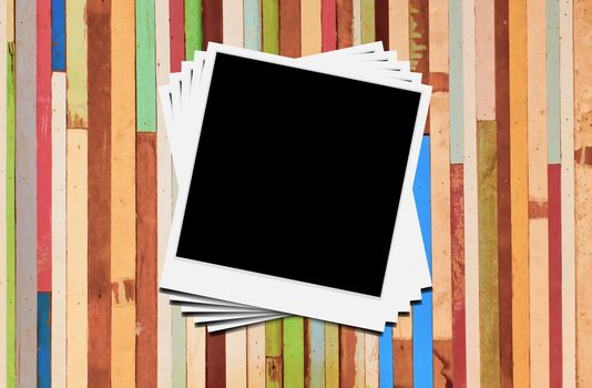 Blank instant photo frames on wooden background. 