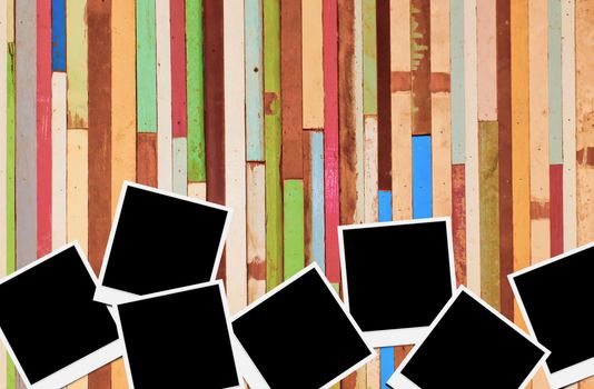 Blank instant photo frames on wooden background. 