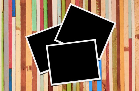 Blank instant photo frames on wooden background. 