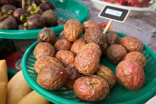 Fresh passion fruit maracuja heap at asian open market