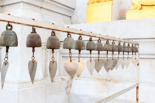 Lots of small bells hanging in the thai church.