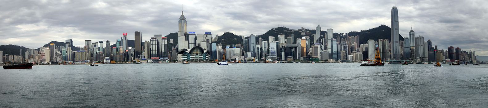 HONG KONG - APRIL 26:  Panorama of 10 frames. View of modern skyscrapers in downtown Hong Kong on sunset, China on April 26, 2014. 