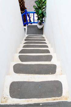 Way down modern stair in shopping center.