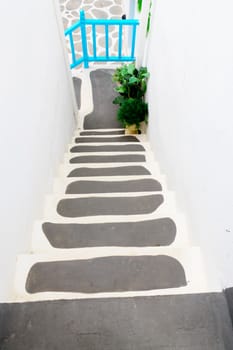 Way down modern stair in shopping center.