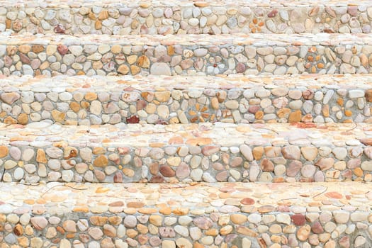 The way up stair are made from stone.