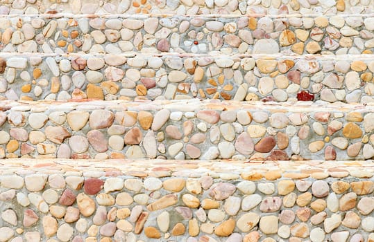 The way up stair are made from stone.