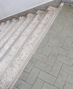 Way down modern stair in shopping center.