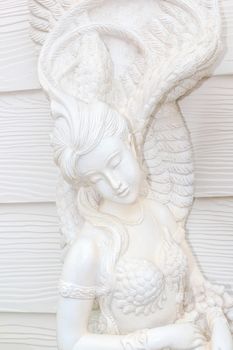 Statue of woman looks like an angel.