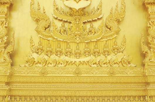 Statue on the walll Thai style art painting on wall of the temple.