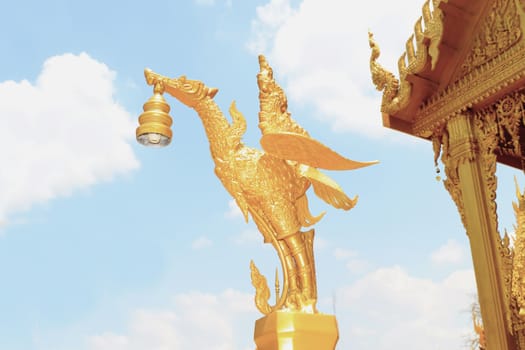 Golden swan statue at Wat Paknam Joelo in Chachoengsao province at thailand.