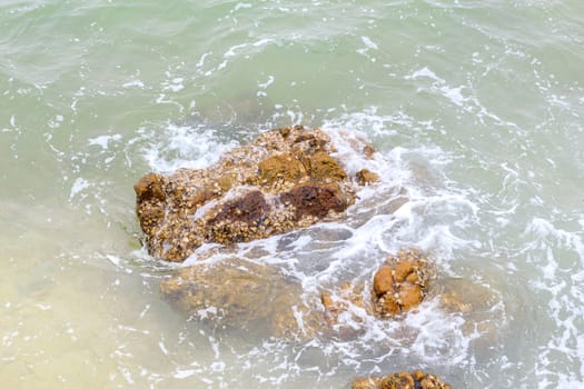 Rock the ocean waves crashing all the time.