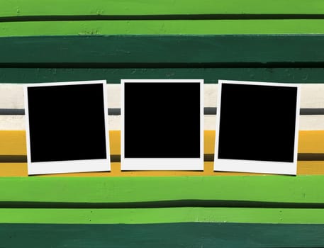Blank instant photo frames on Wooden floor. 
