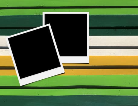 Blank instant photo frames on Wooden floor. 