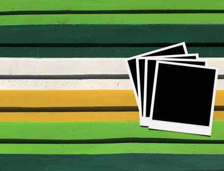 Blank instant photo frames on Wooden floor. 