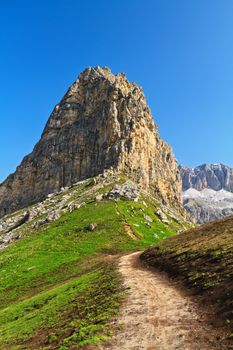 summer landscape with a small footpath in Pordoi pass Belvedere, Italian Dolomites