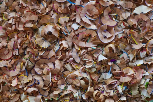 Background of colored pencils wood shavings