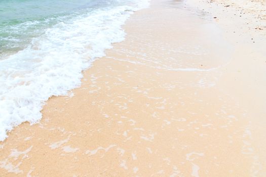 Soft wave of the sea on the sandy beach.