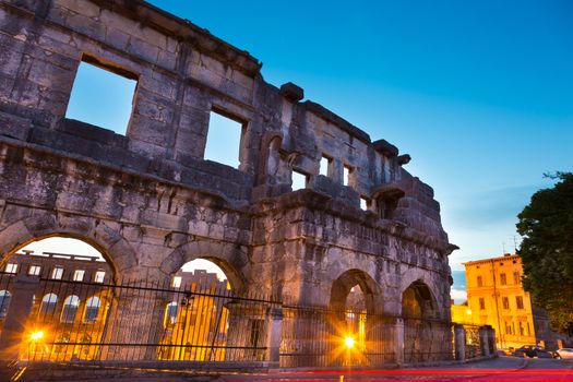 The Roman Amphitheater of Pula, Croatia shot at dusk. It was constructed in 27 - 68 AD and is among the six largest surviving Roman arenas in the World and best preserved ancient monument in Croatia.