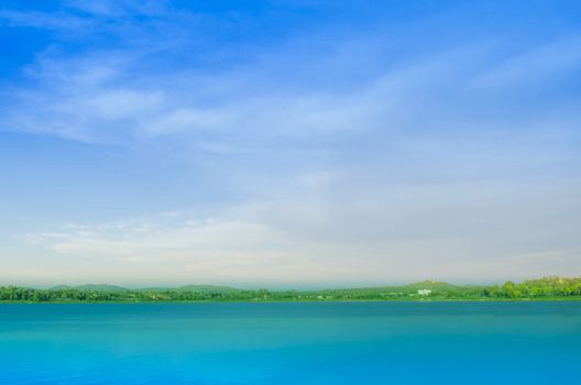 Lake and colorful cloudy blue sky.