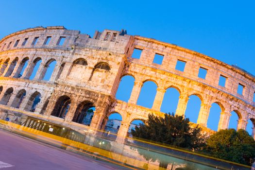 The Roman Amphitheater of Pula, Croatia shot at dusk. It was constructed in 27 - 68 AD and is among the six largest surviving Roman arenas in the World and best preserved ancient monument in Croatia.