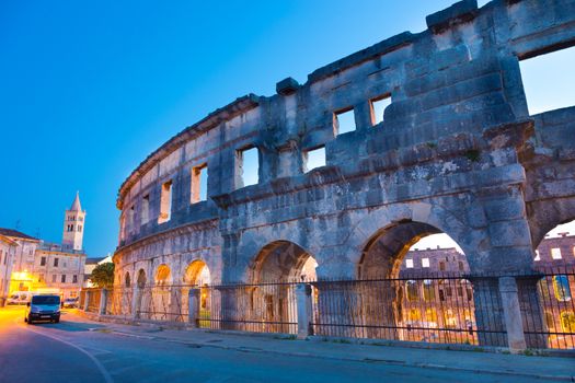 The Roman Amphitheater of Pula, Croatia shot at dusk. It was constructed in 27 - 68 AD and is among the six largest surviving Roman arenas in the World and best preserved ancient monument in Croatia.