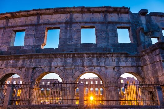 The Roman Amphitheater of Pula, Croatia shot at dusk. It was constructed in 27 - 68 AD and is among the six largest surviving Roman arenas in the World and best preserved ancient monument in Croatia.