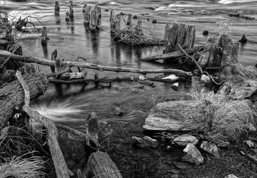 Nice wilderness weir on the river, black and white