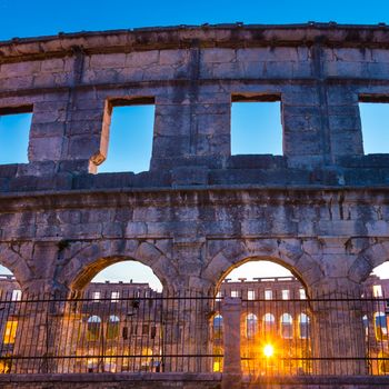 The Roman Amphitheater of Pula, Croatia shot at dusk. It was constructed in 27 - 68 AD and is among the six largest surviving Roman arenas in the World and best preserved ancient monument in Croatia.