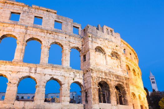 The Roman Amphitheater of Pula, Croatia shot at dusk. It was constructed in 27 - 68 AD and is among the six largest surviving Roman arenas in the World and best preserved ancient monument in Croatia.