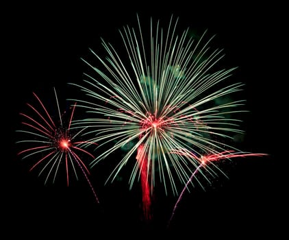 Exposure of multiple fireworks with a black sky.