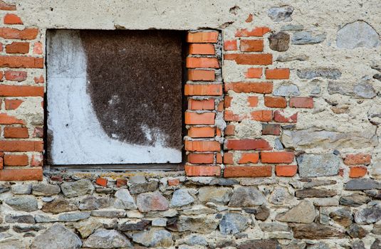 Empty window with wooden desk in old abandoned house.