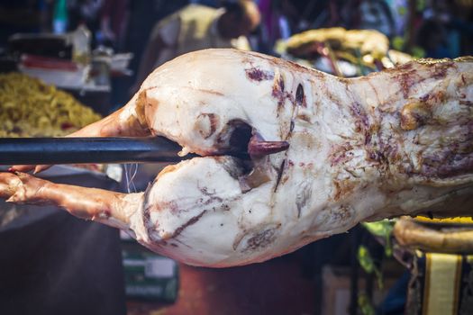 huge grilled pork fact, medieval fair in Spain