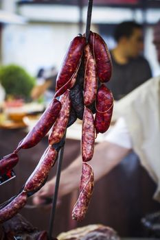 lots of sausages and chorizos in a medieval fair