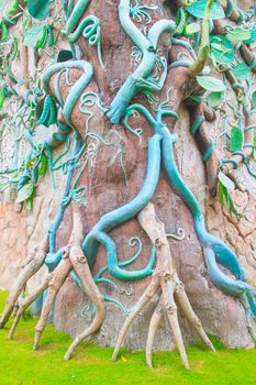 Giant beanstalk ivy plants on the fake tree.