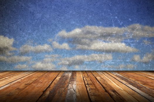 abstract scratched backdrop with wood terrace and grungy beautiful blue sky