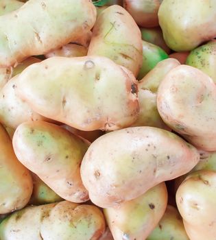 Potatoes raw vegetables food pattern in market.