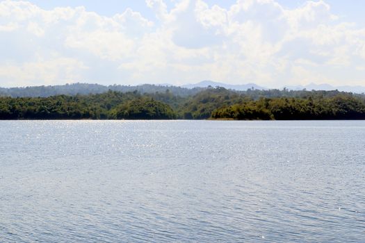 Water with light shining from one lake in the dam.