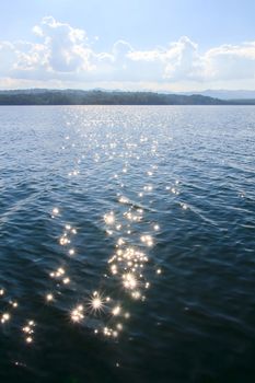 Water with light shining from one lake in the dam.