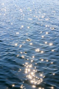 Water with light shining from one lake in the dam.