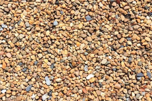 Texture background of white and brown rounded stone.