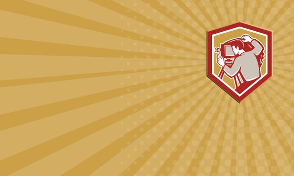Business card illustration of a vintage movie film camera with photographer setting it up set inside shield crest shape done in retro woodcut style.