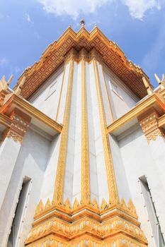 Worms eye view of corner of Thai architecture at Wat Traimitr, China town, Thailand.